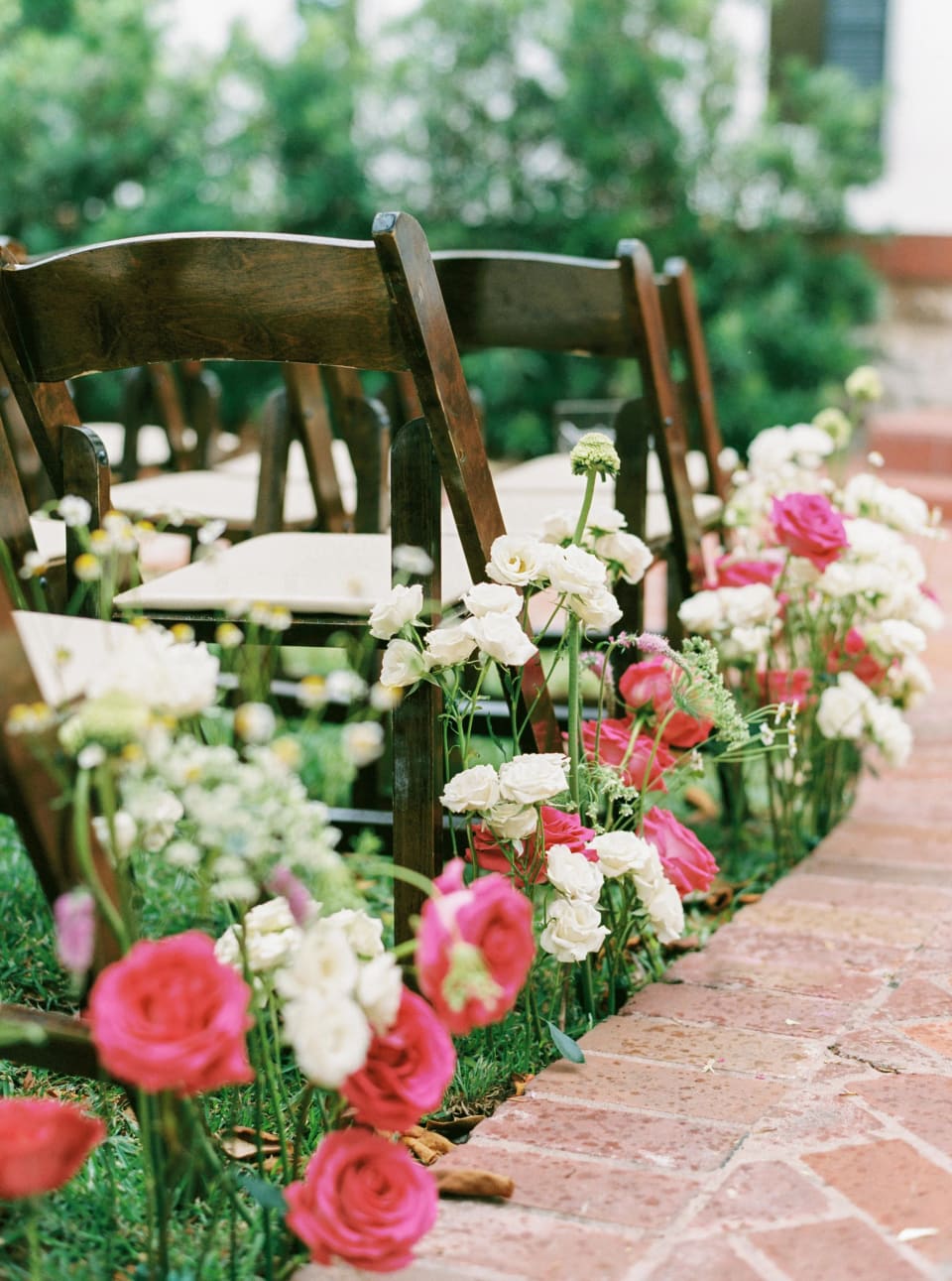 Ceremony aisle lined with pink and white garden florals at Woodbine Mansion